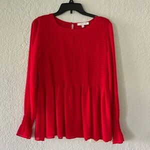 Red smocked blouse